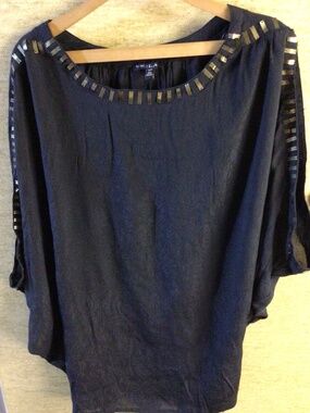 5/$25.00 Size small oversized women’s batwing black top with gold accents
